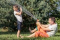 Happy father and son playing in the garden at the day time. Royalty Free Stock Photo