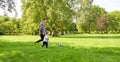 Happy father and son playing soccer at summer park Royalty Free Stock Photo