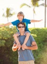 Happy father and son playing on tropical beach, carefree happy f Royalty Free Stock Photo