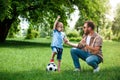 happy father and son showing yes sign after playing football Royalty Free Stock Photo