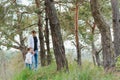 Happy father and son sitting in the park. Smiling young man spending time together with his son Royalty Free Stock Photo