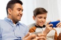 Happy father and son with smartphones at home Royalty Free Stock Photo