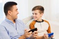 Happy father and son with smartphones at home Royalty Free Stock Photo