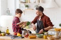 Happy father son spending time together on kitchen Royalty Free Stock Photo