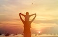 Happy father and son on sunset beach Royalty Free Stock Photo