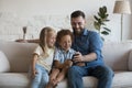 Happy father teaching daughter and son kids to use app Royalty Free Stock Photo