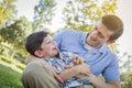 Happy Father Tickling Son in the Park Royalty Free Stock Photo