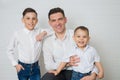 Happy Father and two Sons. Fathers day. Studio portrait over white background. Royalty Free Stock Photo