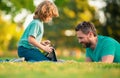 Happy father using laptop relax with schooler son holding laptop have fun together, smiling dad and little boy child Royalty Free Stock Photo