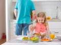 Happy father withpretty daughter having fun breakfast Royalty Free Stock Photo