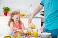 Happy father withpretty daughter having fun breakfast Royalty Free Stock Photo
