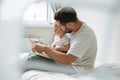 Happy father young man and baby girl little daughter having fun reading a book in children room at home Royalty Free Stock Photo