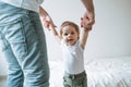 Happy father young man and baby girl little daughter having fun in children room at home Royalty Free Stock Photo