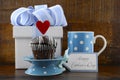 Happy Fathers Concept with blue and white gift and cupcake. Royalty Free Stock Photo