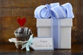 Happy Fathers Concept with blue and white gift and cupcake.