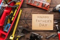 Happy Fathers Day background, card on rustic wood with repair tools Royalty Free Stock Photo