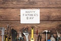 Happy Fathers Day background, card on rustic wood with repair tools Royalty Free Stock Photo