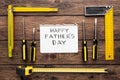 Happy Fathers Day background, card on rustic wood with repair tools Royalty Free Stock Photo