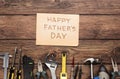 Happy Fathers Day background, card on rustic wood with repair tools Royalty Free Stock Photo