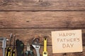 Happy Fathers Day background, card on rustic wood with repair tools Royalty Free Stock Photo