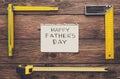 Happy Fathers Day background, card on rustic wood with repair tools Royalty Free Stock Photo