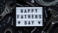 Happy Fathers Day banner concept.Working repair tools upholstery stapler,screwdriver,screws,adjustable wrench,duct tape and light Royalty Free Stock Photo