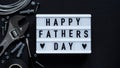 Happy Fathers Day banner concept.Working repair tools upholstery stapler,screwdriver,screws,adjustable wrench,duct tape and light Royalty Free Stock Photo