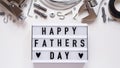 Happy Fathers Day banner concept.Working repair tools upholstery stapler,screwdriver,screws,adjustable wrench,duct tape and light Royalty Free Stock Photo