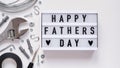 Happy Fathers Day banner concept.Working repair tools upholstery stapler,screwdriver,screws,adjustable wrench,duct tape and light Royalty Free Stock Photo