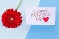 Happy Fathers Day. Blue minimal background with a card hand made a heart with the inscription: Happy Father& x27;s Day and Royalty Free Stock Photo