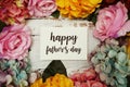 Happy Fathers day Card with colorful flowers border frame on wooden background Royalty Free Stock Photo