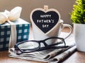 Happy fathers day concept. coffee cup with gift box, heart tag w Royalty Free Stock Photo