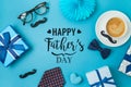 Happy Fathers day concept with coffee cup,  tie bow and gift box on blue background Royalty Free Stock Photo