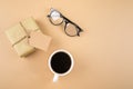 Happy Fathers Day concept. Gift present box, eyeglasses, mustache, cup of coffee on background