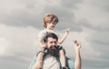 Happy fathers day. Dad and son are playing on sky background. Father and son in the park. Freedom to Dream - Joyful Boy Royalty Free Stock Photo