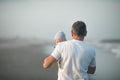 Happy Fathers day. Father and baby play on the beach. Dad and him Child together enjoying sunset. Loving single father hugs cute Royalty Free Stock Photo