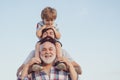 Happy fathers day. Father and son enjoying outdoor. Men generation: grandfather father and grandson are hugging looking