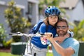 Happy fathers day. Father teaching son cycling on bike. Father learn little son to ride a bicycle. Happy loving family Royalty Free Stock Photo