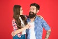 Happy fathers day. Man bearded father and cute little girl daughter on red background. Celebrate fathers day. Family Royalty Free Stock Photo