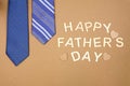 Happy Fathers Day message with blue neck ties over brown paper Royalty Free Stock Photo