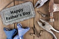 Happy Fathers Day metal sign with tools and ties on wood Royalty Free Stock Photo
