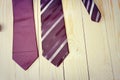 Happy Fathers Day with red, gray and black striped necktie on pine wood background in vintage style Royalty Free Stock Photo