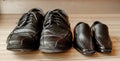 Happy fathers day, fathers shoes and baby boys shoes overhead, flat lay Royalty Free Stock Photo