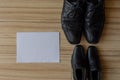 Happy fathers day, fathers shoes and baby boys shoes overhead, flat lay Royalty Free Stock Photo