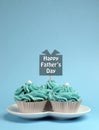 Happy Fathers Day special treat blue and white beautiful decorated cupcakes - vertical. Royalty Free Stock Photo