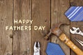 Happy Fathers Day wood letters with tools and ties on rustic wood Royalty Free Stock Photo