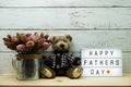 Happy Fathers Day word on light box with teddy bear Royalty Free Stock Photo