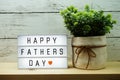 Happy Fathers Day word on light box on wooden background Royalty Free Stock Photo