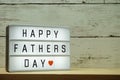 Happy Fathers Day word on light box on wooden background Royalty Free Stock Photo