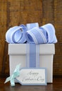 Happy Fathers Gift with blue and white gift on wood background. Royalty Free Stock Photo